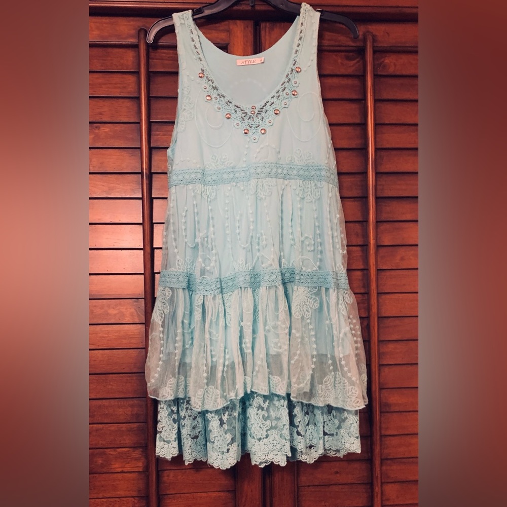 Worn once to a wedding. This soft boho aqua lace dress is unique!